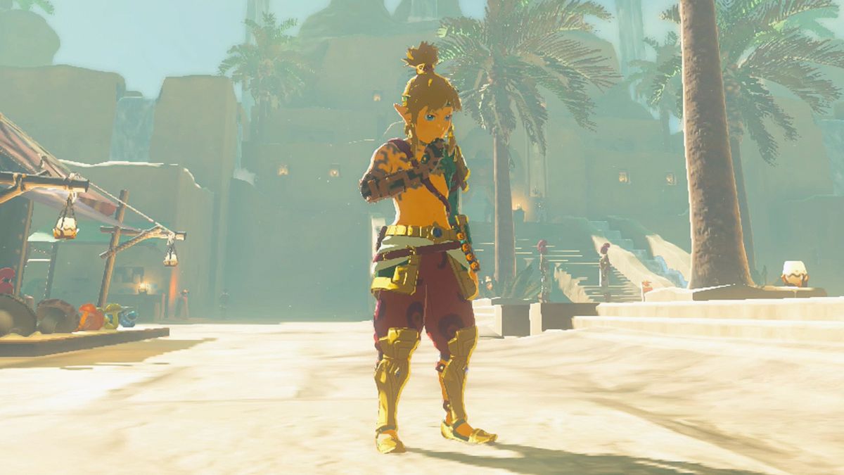 Link wears the Desert Voe Armor while standing in a desert on a sunny day in Zelda Tears of the Kingdom.