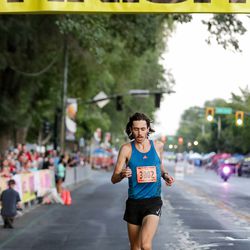 Jerrell Mock, 23, of Providence, finishes first in the Deseret News 10K at Liberty Park in Salt Lake City on Tuesday, July 24, 2018.