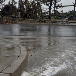 Rainwater flows down Alverstone Avenue in Ventura, Calif., Monday, Jan. 8, 2018. The wet and windy system moving ashore could soak much of the state and drop several inches in parts of Santa Barbara and Ventura counties, where the biggest California blaze has burned for more than a month. (Anthony Plascencia/The Ventura County Star via AP)