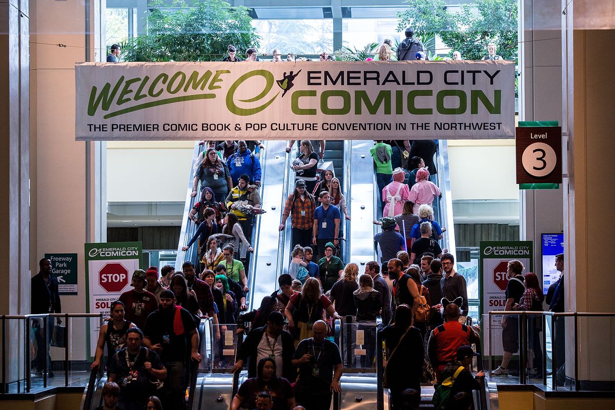 Crowds of fans fill escalators in the Washington State Convention Center for Emerald City Comicon. 