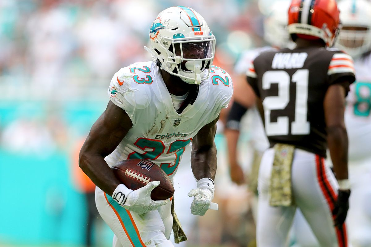 Jeff Wilson Jr. #23 of the Miami Dolphins reacts after rushing for a first down against the Cleveland Browns during the first quarter at Hard Rock Stadium on November 13, 2022 in Miami Gardens, Florida.