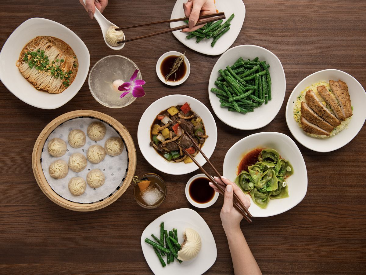 Customers pick out dumplings and food from Din Tai Fung.