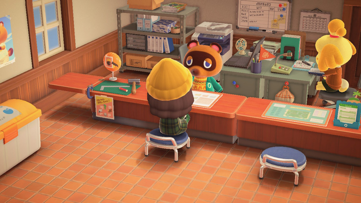 A villager sits at Animal Crossing: New Horizons on Tom Nook’s building bench in the Island Services building