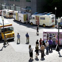 Seven food trucks line the plaza during Food Truck Thursdays at the Gallivan Center in Salt Lake City on Thursday, June 6, 2013.