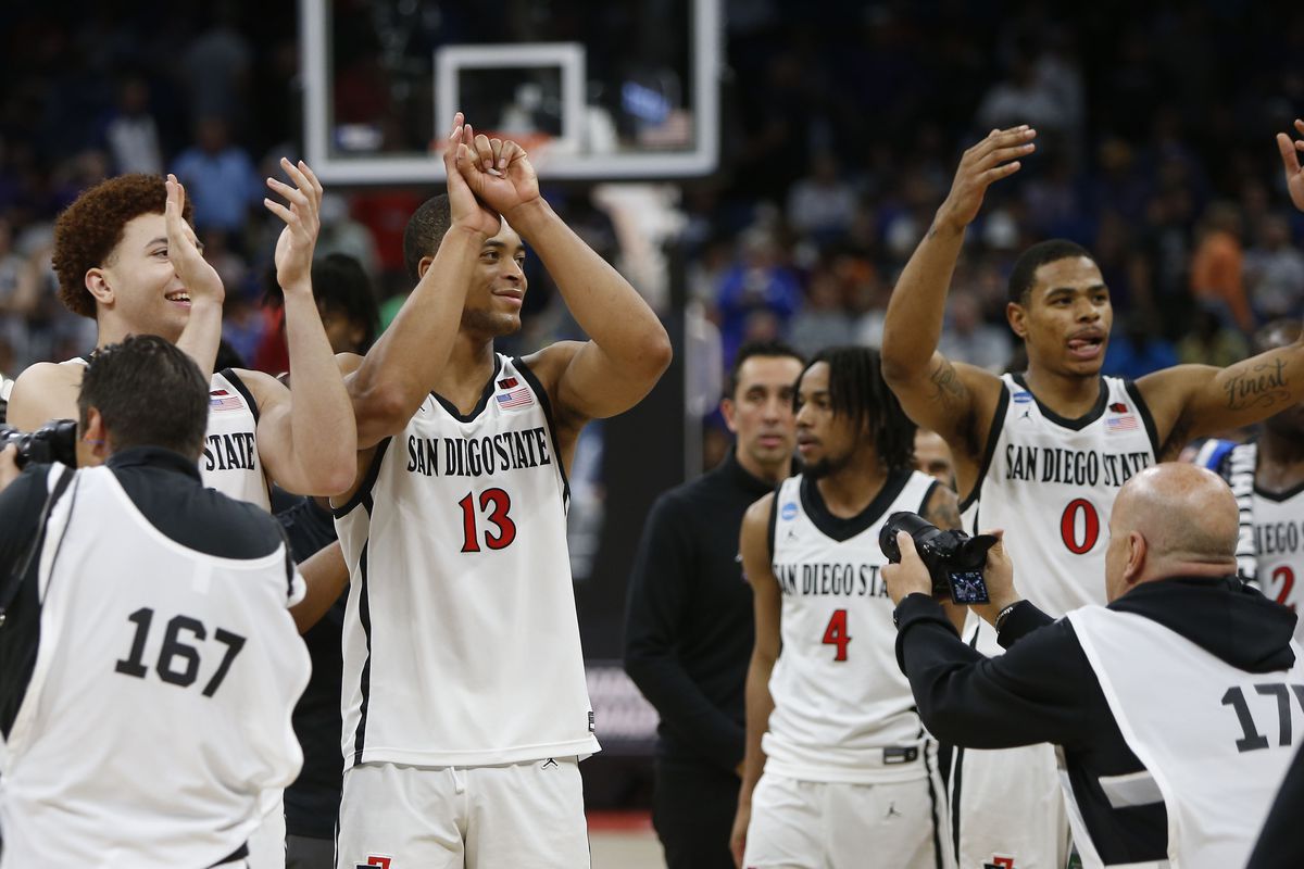 San Diego State Aztecs players celebrate after defeating the Furman Paladins in the second round of the 2023 NCAA Tournament at Legacy Arena
