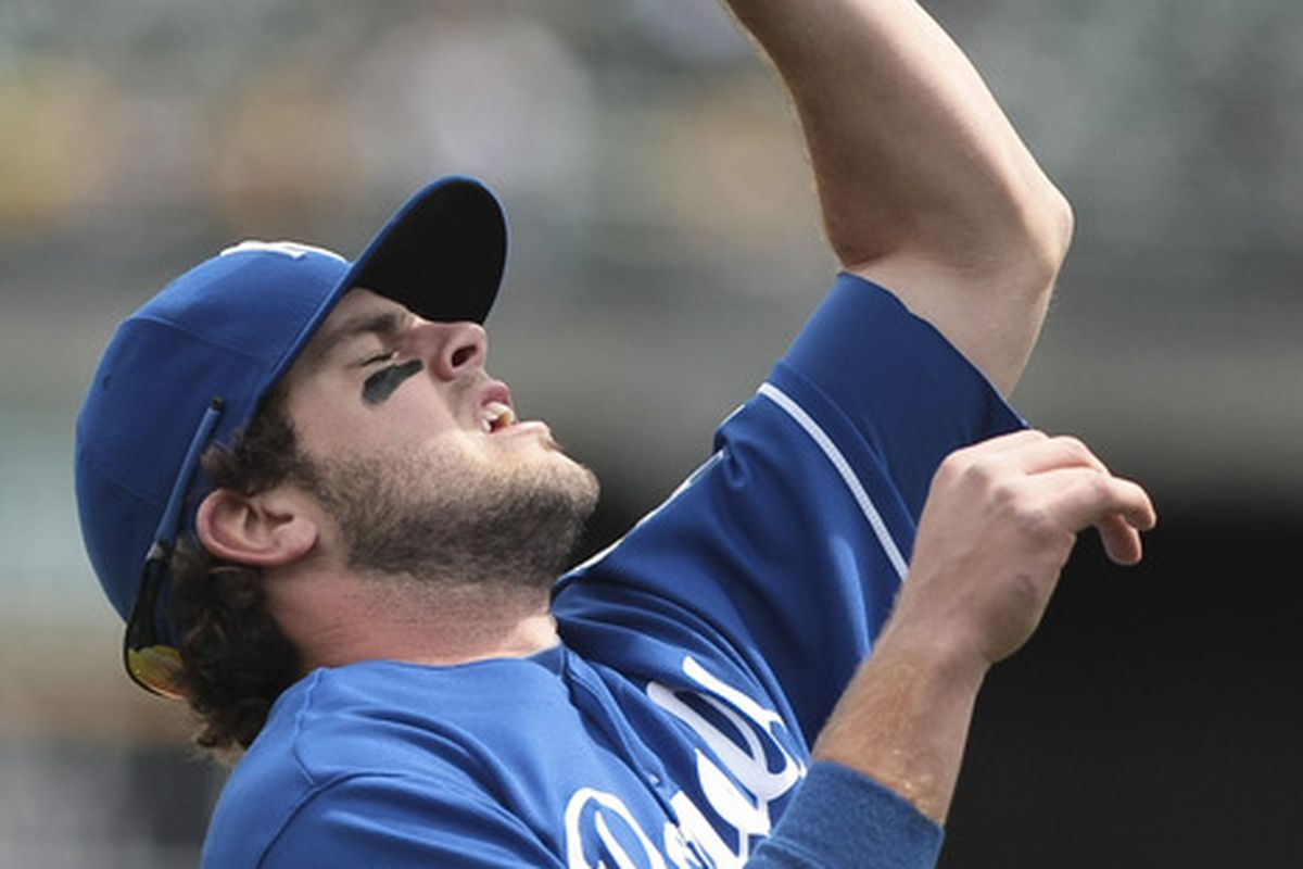 April 11, 2012; Oakland, CA, USA; Kansas City Royals third baseman Mike Moustakas (8) catches the ball for an out against the Oakland Athletics during the first inning at O.co Coliseum. Mandatory Credit: Kelley L Cox-US PRESSWIRE