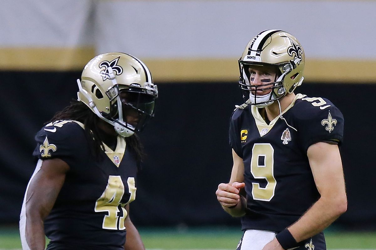 Drew Brees #9 of the New Orleans Saints and Alvin Kamara #41 react against the Carolina Panthers during a game at the Mercedes-Benz Superdome on October 25, 2020 in New Orleans, Louisiana.