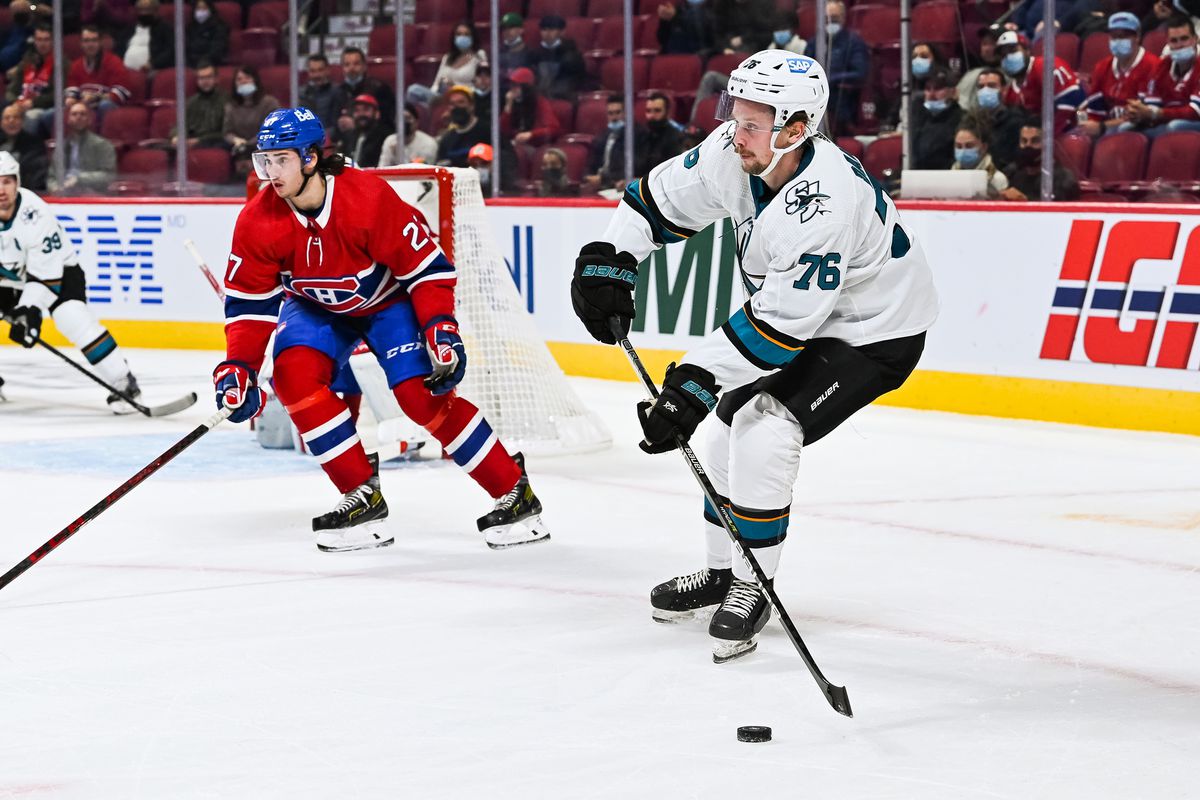 San Jose Sharks center Jonathan Dahlen (76) passes the puck during the San Jose Sharks versus the Montreal Canadiens game on October 19, 2021, at Bell Centre in Montreal, QC