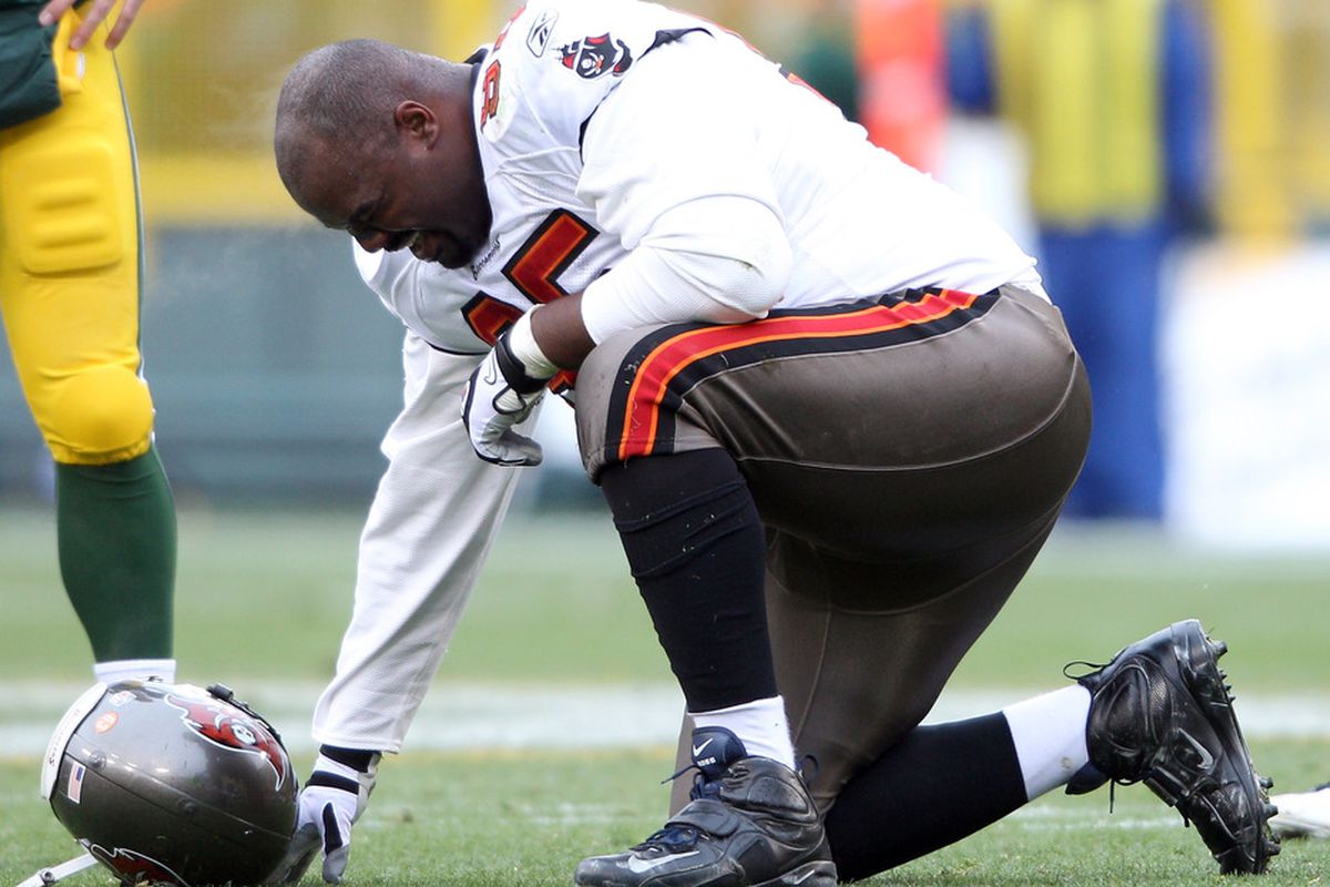 GREEN BAY, WI - NOVEMBER 20:  Albert Haynesworth #95 of the Tampa Bay Buccaneers is injured in the first half against the Green Bay Packers  on November 20,2011 at Lambeau Field in Green Bay, Wisconsin.  (Photo by Elsa/Getty Images)