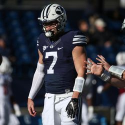 Brigham Young Cougars quarterback Taysom Hill (7) and quarterback Tanner Mangum (12) warm up before a game against the UMass Minutemen at LaVell Edwards Stadium in Provo on Saturday, Nov. 19, 2016.