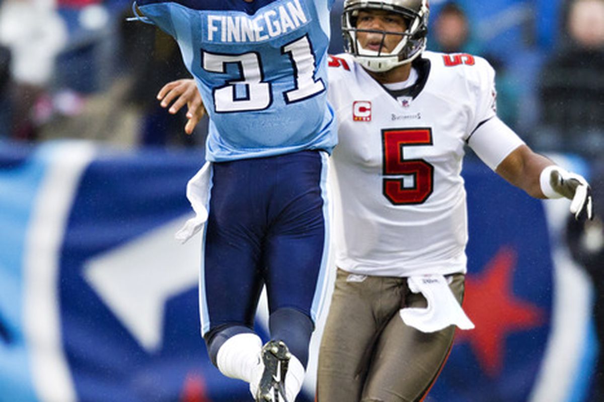 NASHVILLE, TN - NOVEMBER 27:   Quarterback Josh Freeman #5 of the Tampa Bay Buccaneers throws a pass around Cortland Finnegan #31 of the Tennessee Titans at LP Field on November 27, 2011 in Nashville, Tennessee.  (Photo by Wesley Hitt/Getty Images)