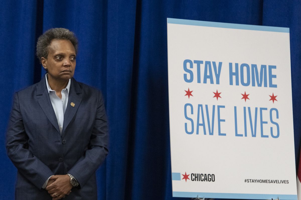 Mayor Lori Lightfoot listens during a news conference in 2020.