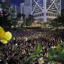 Attendees attend a rally by mothers in Hong Kong on Friday, Jan. 5, 2019. Hong Kong's societal divide showed no sign of closing Friday as students rebuffed an offer from city leader Carrie Lam to meet and a few thousand mothers rallied in support of young protesters who left a trail of destruction in the legislature's building at the start of the week. (AP Photo/Kin Cheung)