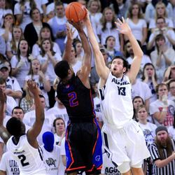 Boise State's Derrick Marks (2) lines up a shot as Utah State's David Collette defends during an NCAA college basketball game, Tuesday, Feb. 3, 2015, in Logan, Utah. (AP Photo/Herald Journal, John Zsiray)