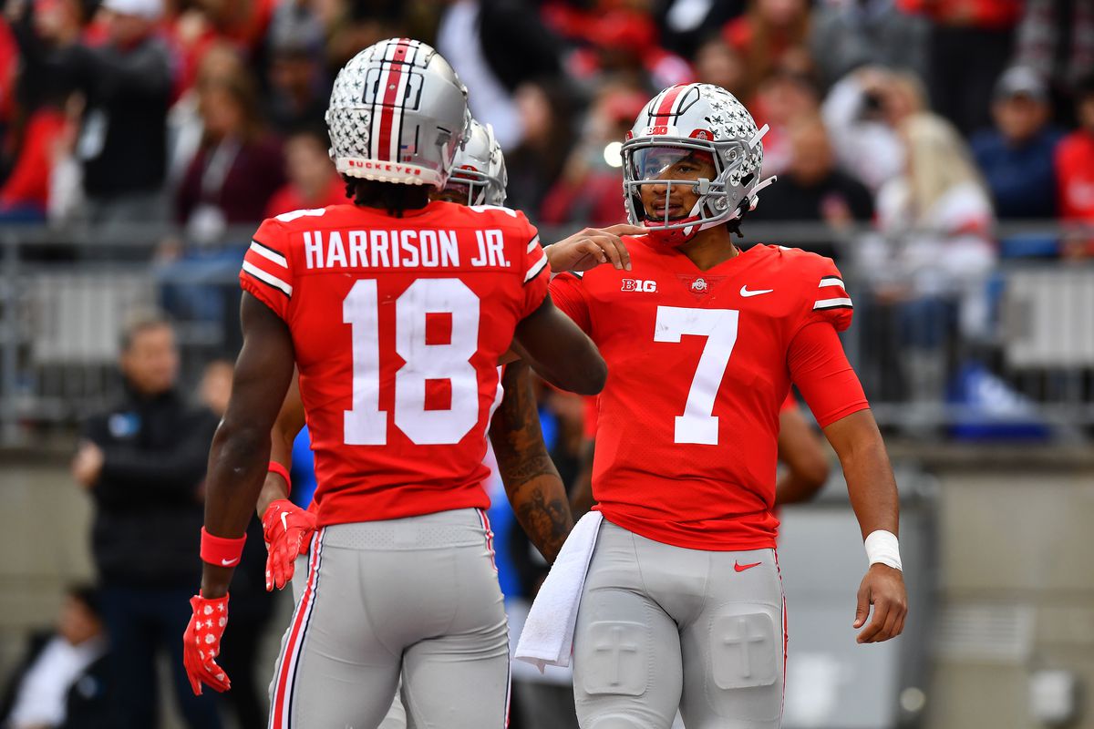 Marvin Harrison Jr. #18 of the Ohio State Buckeyes celebrates his third quarter touchdown with teammate C.J. Stroud #7 during a game against the Rutgers Scarlet Knights at Ohio Stadium on October 01, 2022 in Columbus, Ohio.