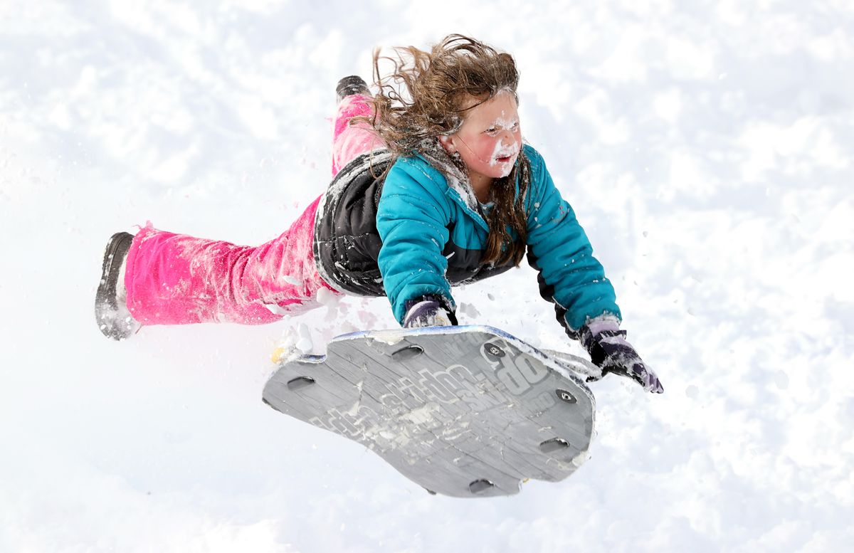 Brynlee McIntosh catches air as she sleds at Riverbend Golf Course in Riverton on Wednesday, Dec. 15, 2021.