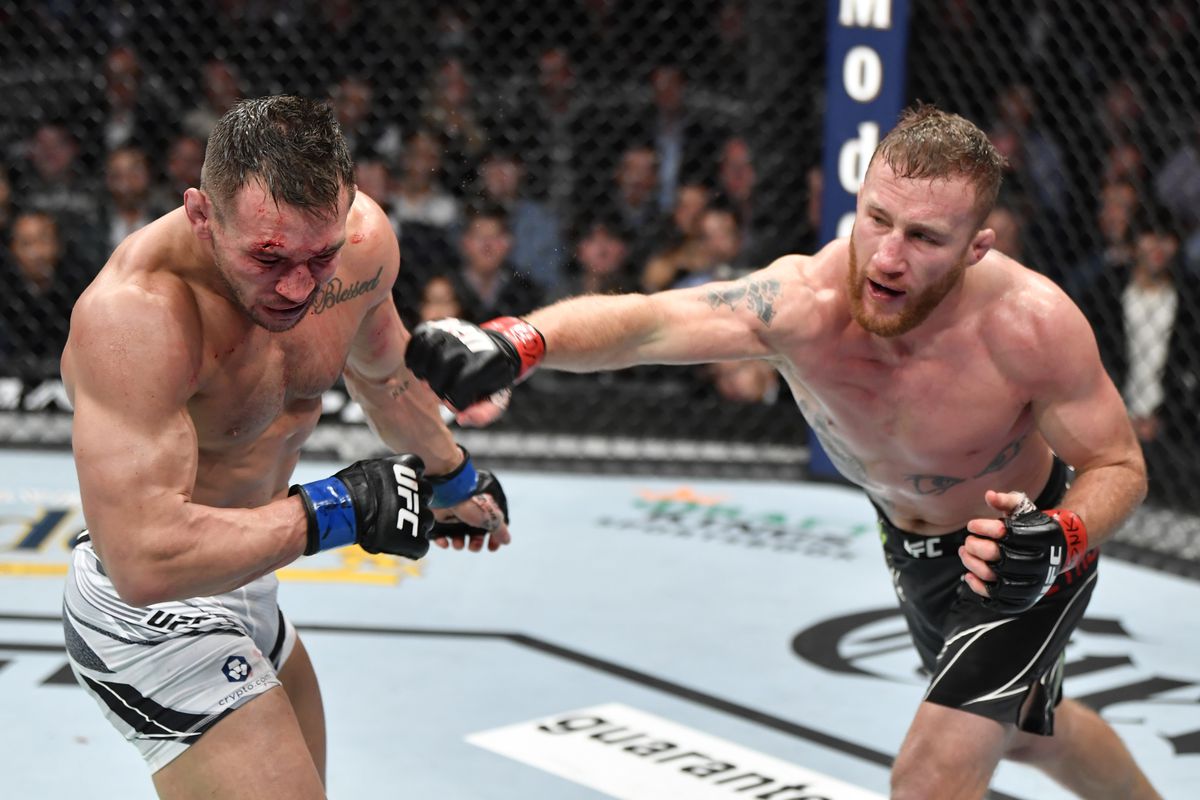 Justin Gaethje punches Michael Chandler in their lightweight fight during the UFC 268 event at Madison Square Garden on November 06, 2021 in New York City.