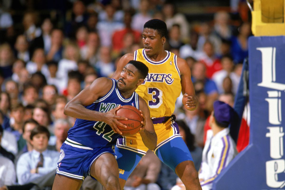 Sam Mitchell is defended by Jay Vincent