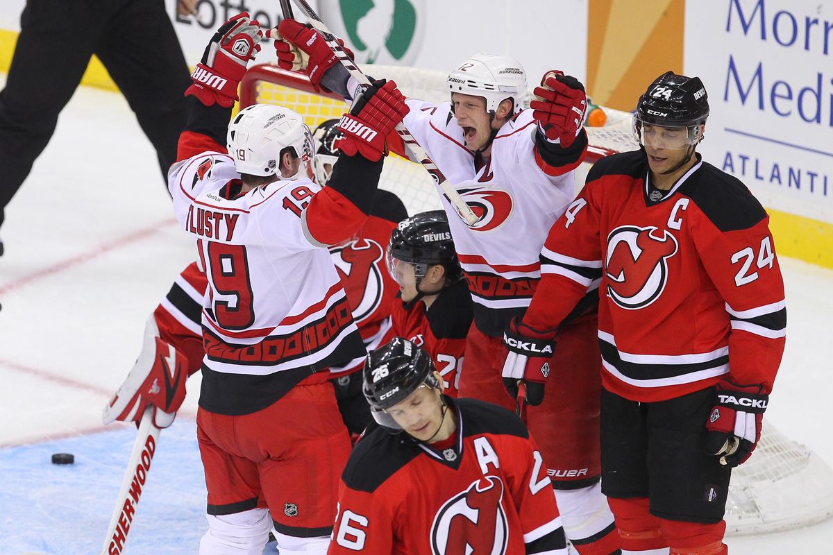 Eric Staal and JiriTlusty celebrate a goal against the Devils