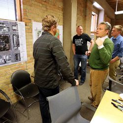 Soren Simonsen, chairman of the Pioneer Park Urban Design Assistance Team, right, talks with other members of the team Sunday, Feb. 8, 2015, during a brainstorming session for ideas of what could be done with the downtown park.