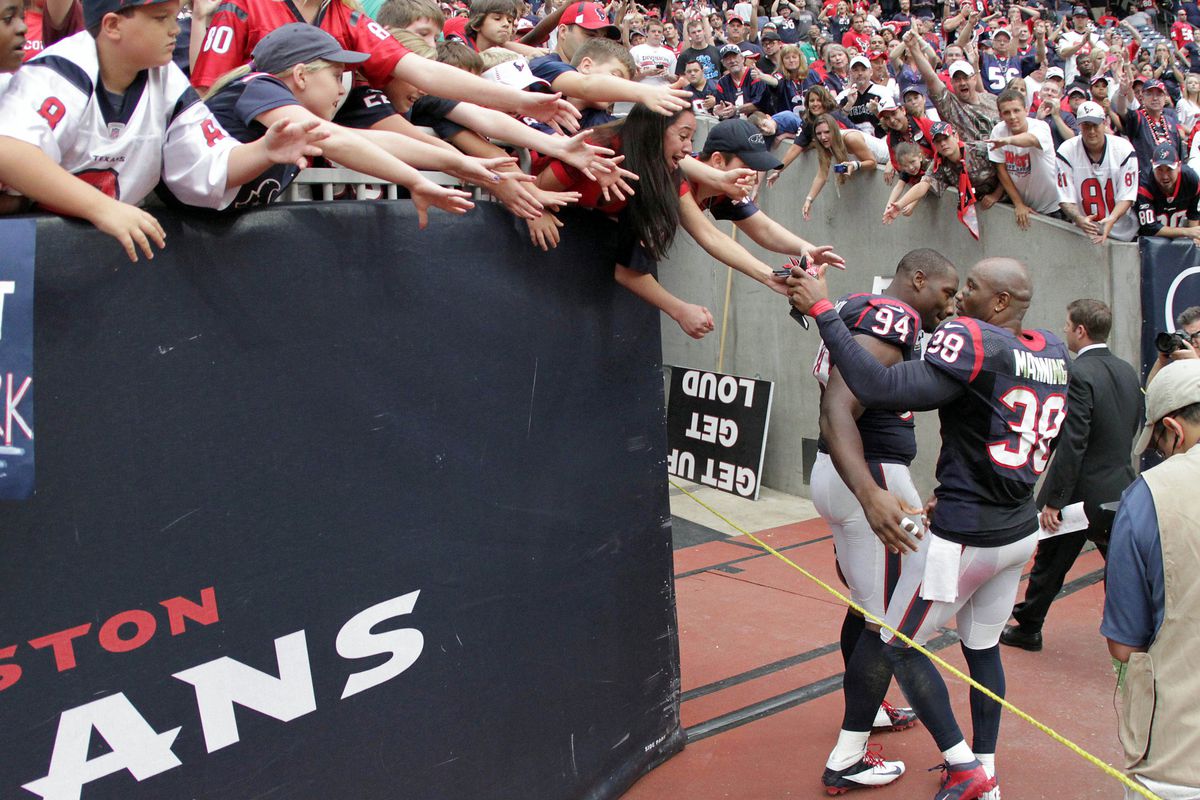 Danieal Manning, celebrating with fans after the last Texans' victory over Tennessee.