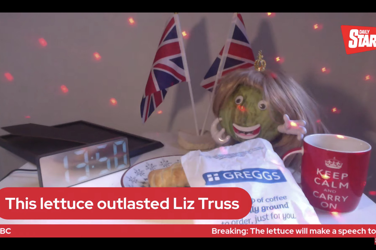 A lettuce surrounded by Union Jacks, bathed in disco ball lights.