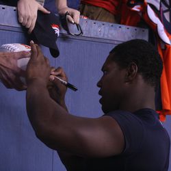 Broncos RB Knowshon Moreno, who was probably having the most fun in the rain, stays and signs autographs for fans after practice