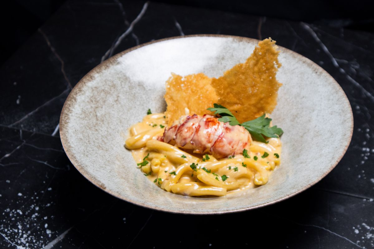 pasta on a dish with lobster.