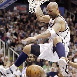 Jazz forward Carlos Boozer slams over the Nuggets during NBA action at EnergySolutions Arena in Salt Lake City on Saturday. The Jazz won, 116-106.