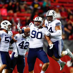 BYU's Corbin Kaufusi (90) celebrates a play during game against UNLV Friday, Nov. 10, 2017, in Las Vegas.