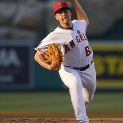 Los Angeles Angels starting pitcher Jason Vargas (60) delivers against the Seattle Mariners in the first inning of a baseball game, Monday, June 17, 2013 in Anaheim, Calif.  