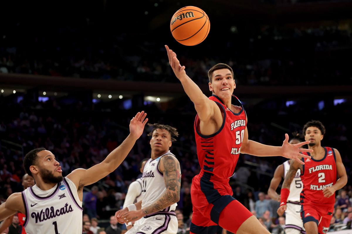 Mar 25, 2023; New York, NY, USA; Florida Atlantic Owls center Vladislav Goldin (50) reaches for a rebound against Kansas State Wildcats guard Markquis Nowell (1) and forward Keyontae Johnson (11) during the second half at Madison Square Garden. Mandatory Credit: Brad Penner