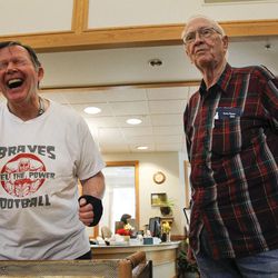 Bob Huish, 66, left, takes shelter from the spiking heat in Utah by playing games with friend Larry Cook, 76, at a designated Salt Lake County Aging and Adult Services "cool zone" at Liberty Senior Center in Salt Lake City on Monday, June 20, 2016.