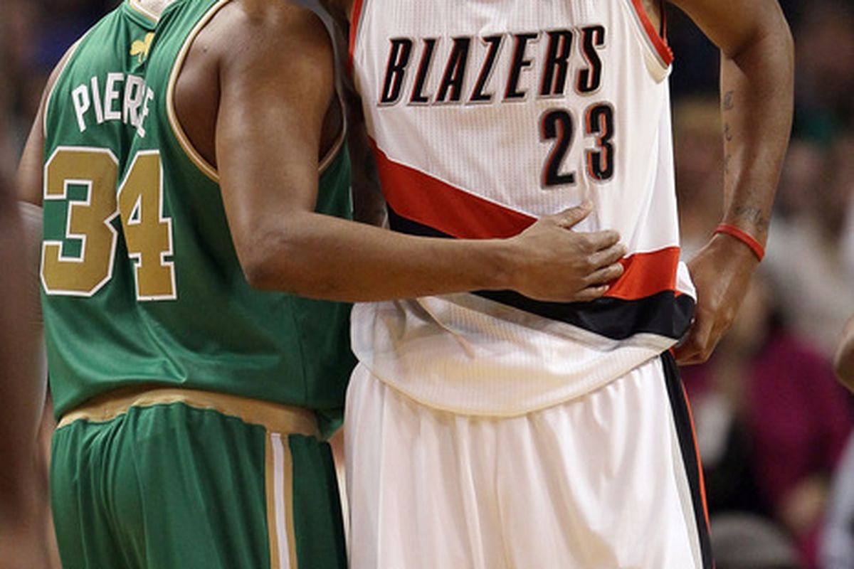 BOSTON, MA - MARCH 09:  Paul Pierce #34 of the Boston Celtics hugs Marcus Camby #23 of the Portland Trail Blazers on March 9, 2012 at TD Garden in Boston, Massachusetts. (Photo by Elsa/Getty Images)