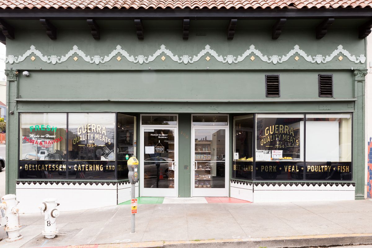 The green exterior of Guerra Quality Meats.