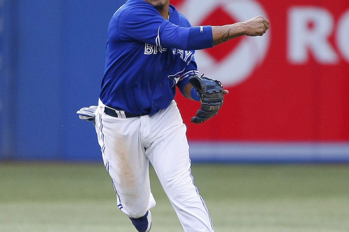 June 28, 2012; Toronto, ON, CANADA; Toronto Blue Jays shortstop Yunel Escobar (5) throws out Los Angeles Angels designated hitter Mark Trumbo (not pictured) at the Rogers Centre.  Mandatory Credit: John E. Sokolowski-US PRESSWIRE