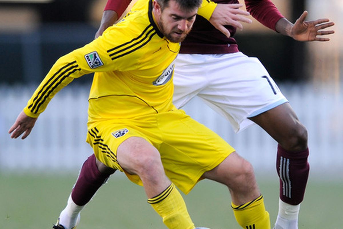 COLUMBUS OH - NOVEMBER 6:  Jason Garey #9 of the Columbus Crew and Macoumba Kandji #10 of the Colorado Rapids battle for control of a loose ball on November 6 2010 at Crew Stadium in Columbus Ohio.  (Photo by Jamie Sabau/Getty Images)