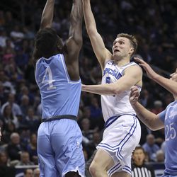 Brigham Young Cougars guard Jake Toolson (5) drives on San Diego Toreros guard Sabry Philip (4) in Provo on Thursday, Jan. 16, 2020. BYU won 93-70.