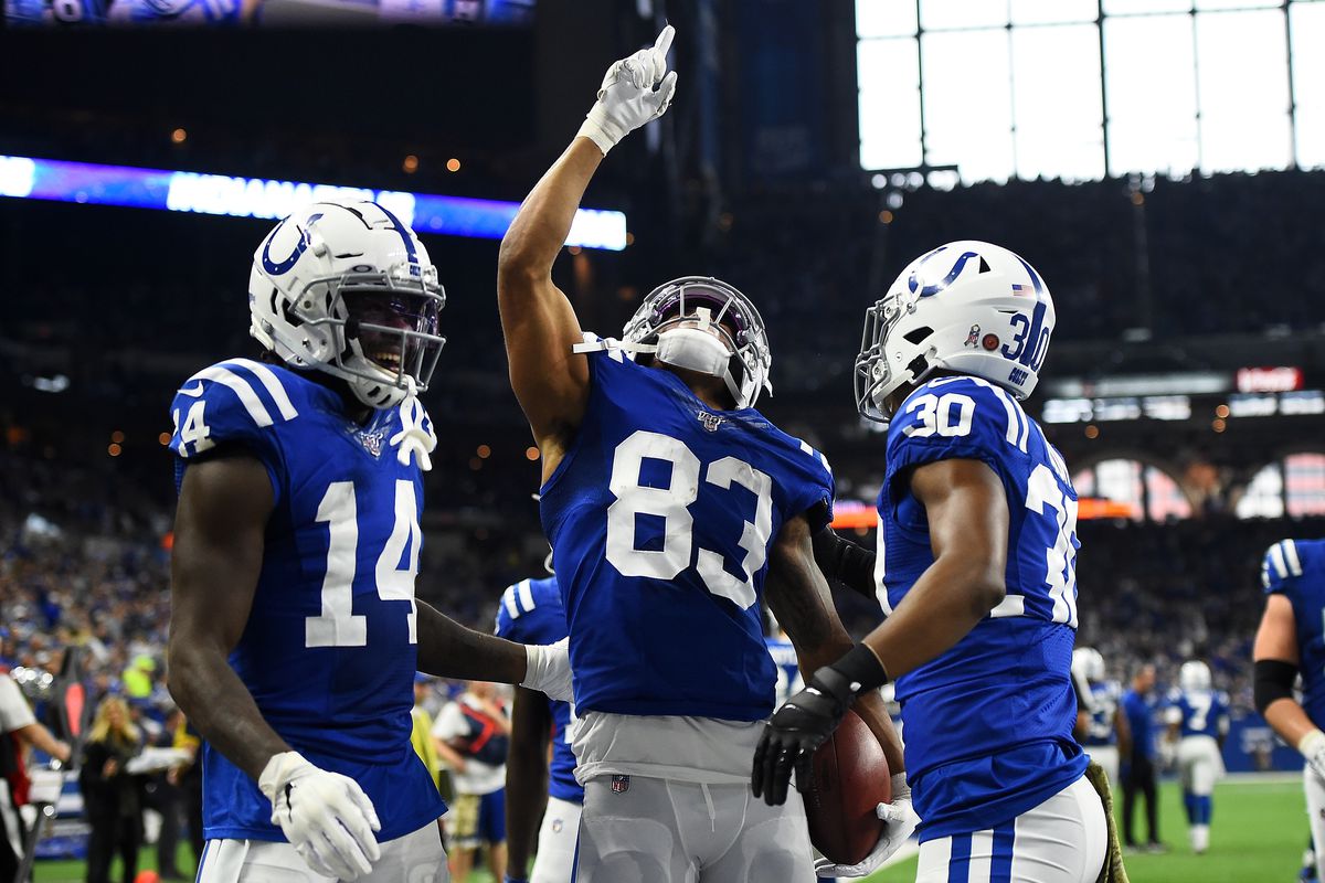 Marcus Johnson of the Indianapolis Colts celebrates a touchdown with Zach Pascal and George Odum during the second half against the Jacksonville Jaguars at Lucas Oil Stadium on November 17, 2019 in Indianapolis, Indiana.
