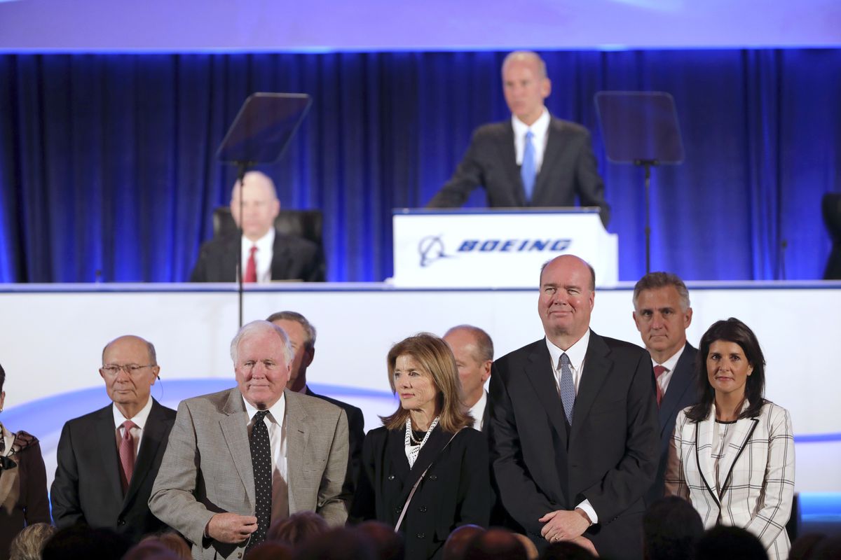 The Boeing board of directors including Nikki Haley, right, and Caroline Kennedy, third from right, are announced by Chief Executive Officer Dennis Muilenburg at the Boeing Annual General Meeting in Chicago, Monday, April 29, 2019. (John Gress/Pool Photo 