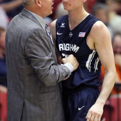BYU coach Dave Rose, left, congratulates forward Josh Sharp after taking him out late in the second half of an NCAA college basketball game against Loyola Marymount, in Los Angeles on Saturday, Feb. 7, 2015. BYU won 87-68.