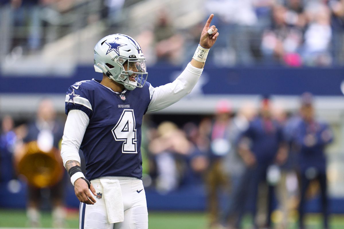 Dak Prescott of the Dallas Cowboys celebrates after scoring a touchdown against the Chicago Bears during the second half at AT&amp;T Stadium on October 30, 2022 in Arlington, Texas.