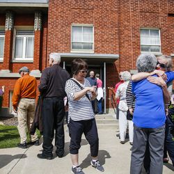 Past members of the Ogden LDS Deaf Branch tour the old building on East 21st Street during a celebration for its 100th anniversary in Ogden on Saturday, May 6, 2017.
