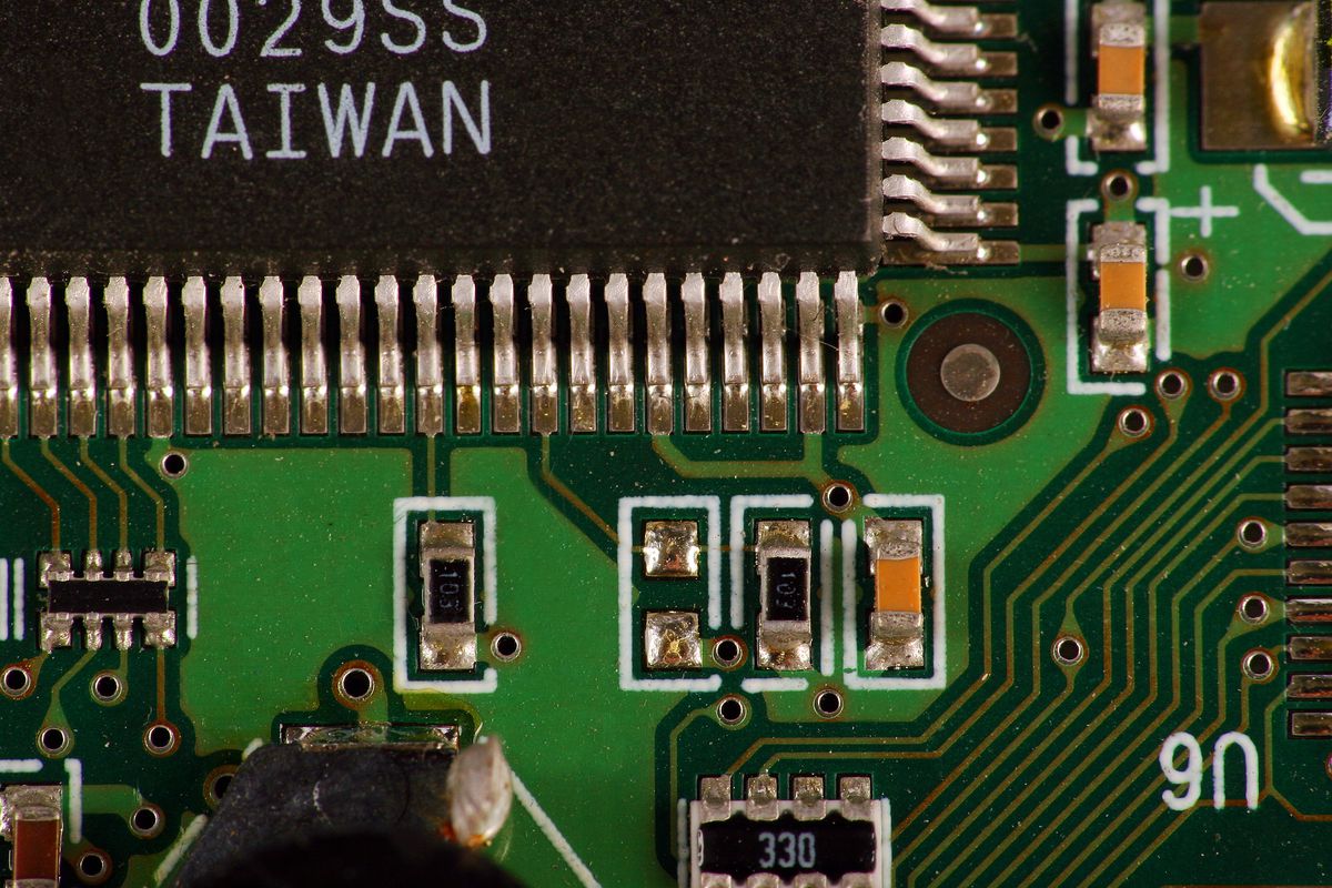 Close-up of a computer chip circuit board with the word “Taiwan” visible as its point of manufacture.