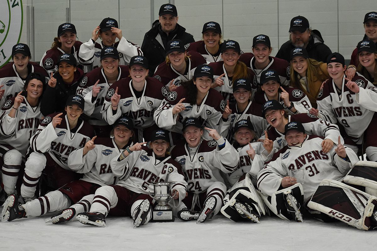 Franklin Pierce’s women’s hockey team poses for a photo with their NEWHA championship trophy.