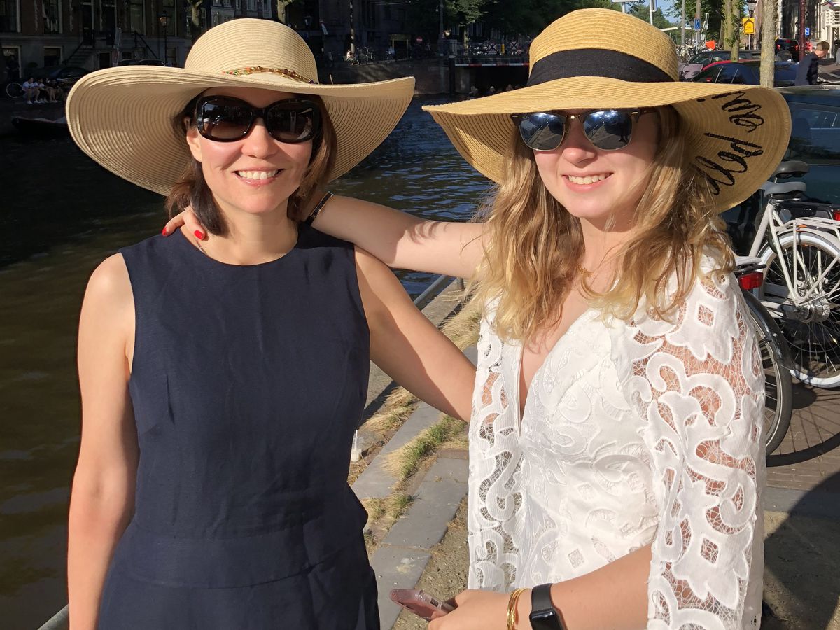 Loyola Medicine dermatologist Dr. Rebecca Tung (left) and her daughter, Eleanor (a Lollapalooza goer), sport some fashionable — and functional — head gear and sunscreen, two key items to help protect you from damaging sun rays. | PROVIDED PHOTO