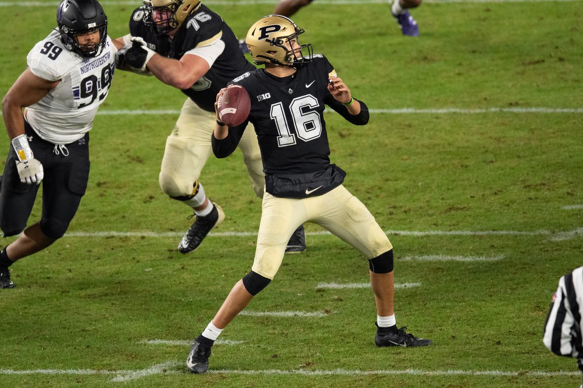 Purdue Boilermakers quarterback Aidan O’Connell looks downfield during the college football game between the Purdue Boilermakers and Northwestern Wildcats on November 14, 2020, at Ross-Ade Stadium in West Lafayette, IN.