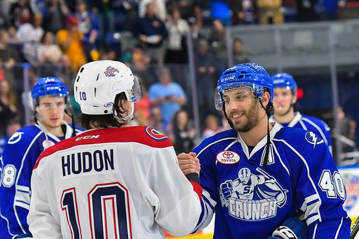 Charles Hudon and Gabriel Dumont share a handshake