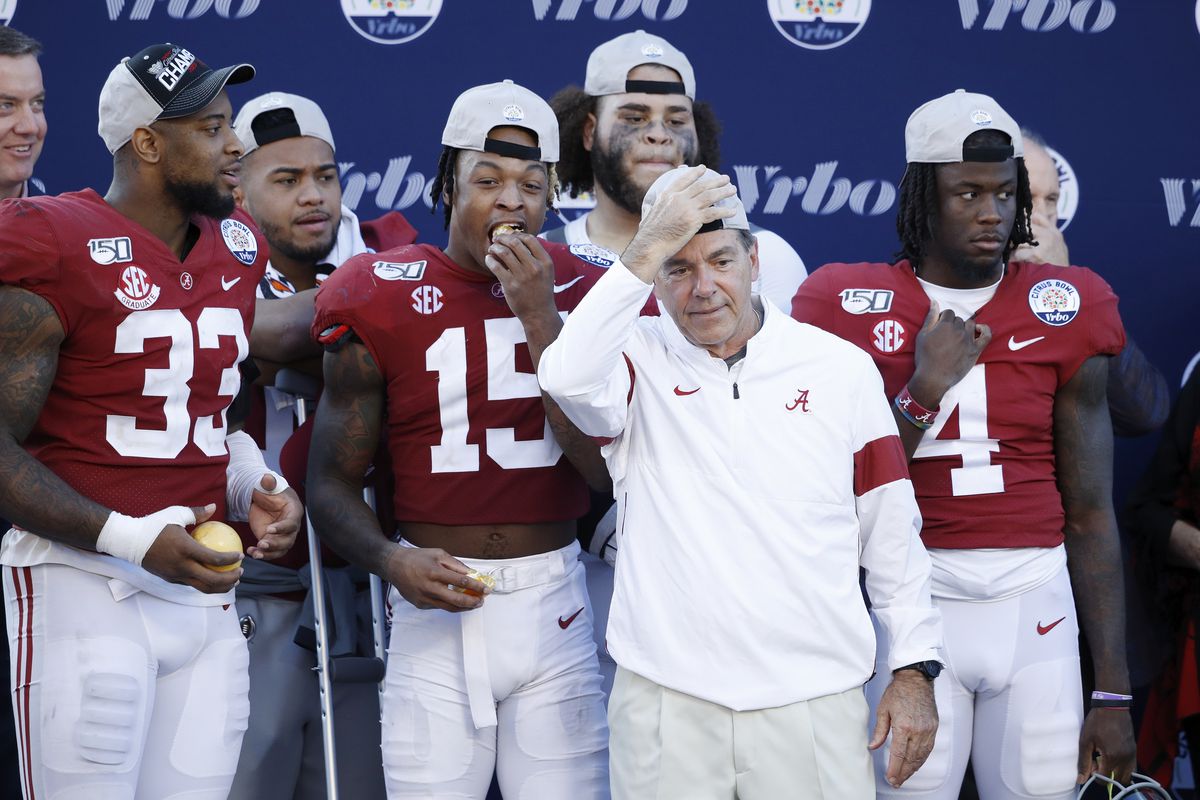 Head coach Nick Saban of the Alabama Crimson Tide celebrates with his players following a win against the Michigan Wolverines in the Vrbo Citrus Bowl at Camping World Stadium on January 1, 2020 in Orlando, Florida.