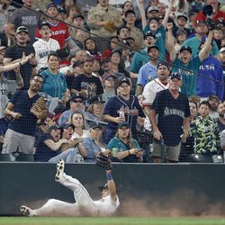 SEATTLE, WASHINGTON - SEPTEMBER 10: Sam Haggerty #0 of the Seattle Mariners catches a foul ball for an out during the eighth inning against the Atlanta Braves at T-Mobile Park on September 10, 2022 in Seattle, Washington